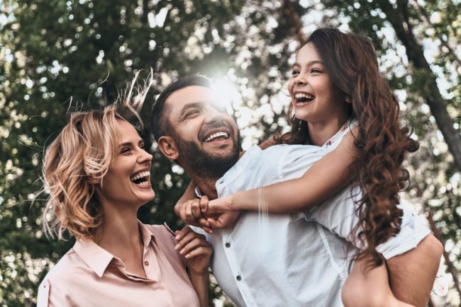 Family,Bonds.,Happy,Young,Family,Of,Three,Smiling,While,Spending Dentist Near Me San Francisco