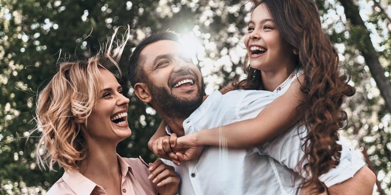 Family,Bonds.,Happy,Young,Family,Of,Three,Smiling,While,Spending Dentist Near Me San Francisco