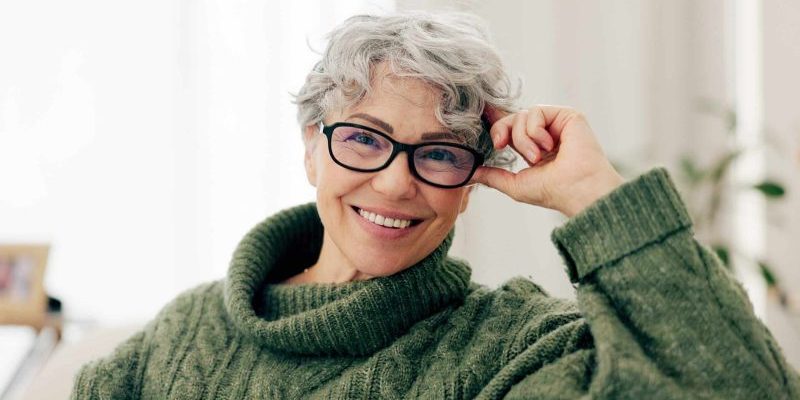 Happy,,Face,And,Senior,Woman,On,Sofa,To,Relax,In Dental Implants in San Francisco