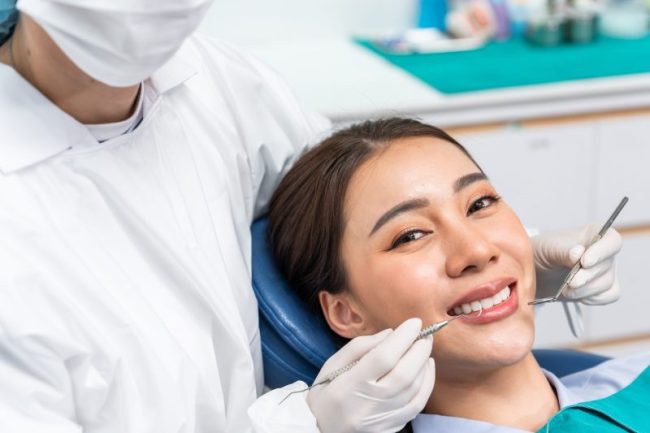 Caucasian,Dentist,Examine,Tooth,For,Young,Girl,At,Dental,Health Dentist Near Me San Francisco