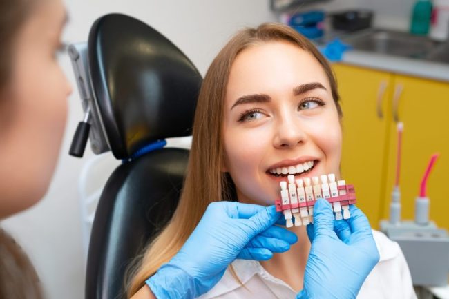 Dentist,Selects,A,Shade,Of,Teeth,Whitening,Using,Shade,Guide Dental Veneers San Francisco