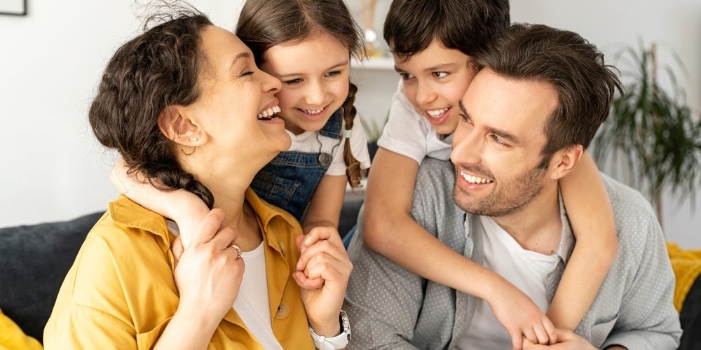 Happy,Together.,Portrait,Of,Cheerful,Multiracial,Family,Of,Four,