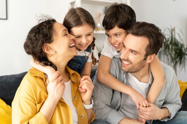 Happy,Together.,Portrait,Of,Cheerful,Multiracial,Family,Of,Four,
